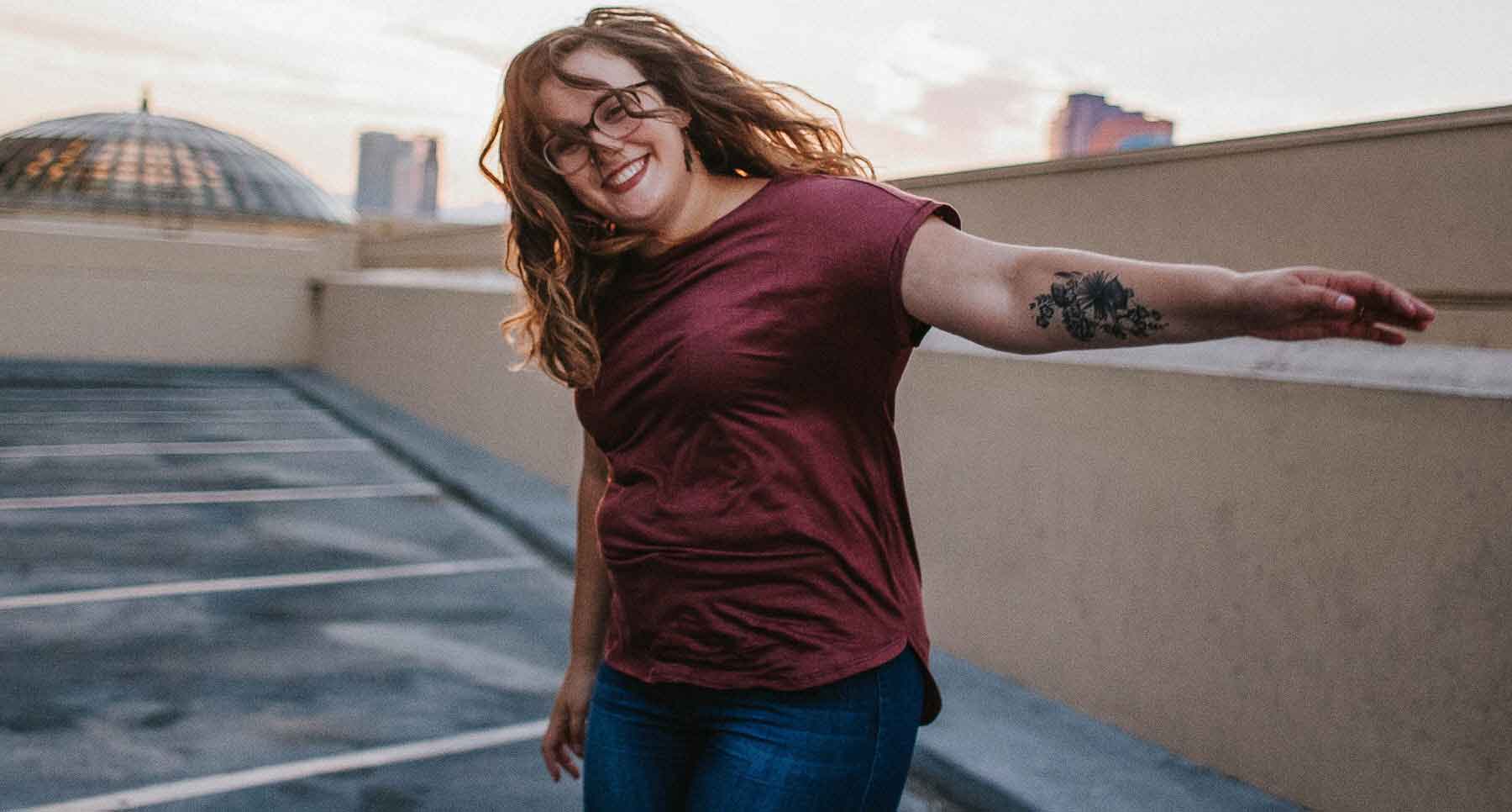 girl-with-tattoo-smiling-and-happy-to-live